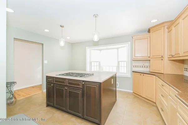 a kitchen with a stove top oven sink and cabinets