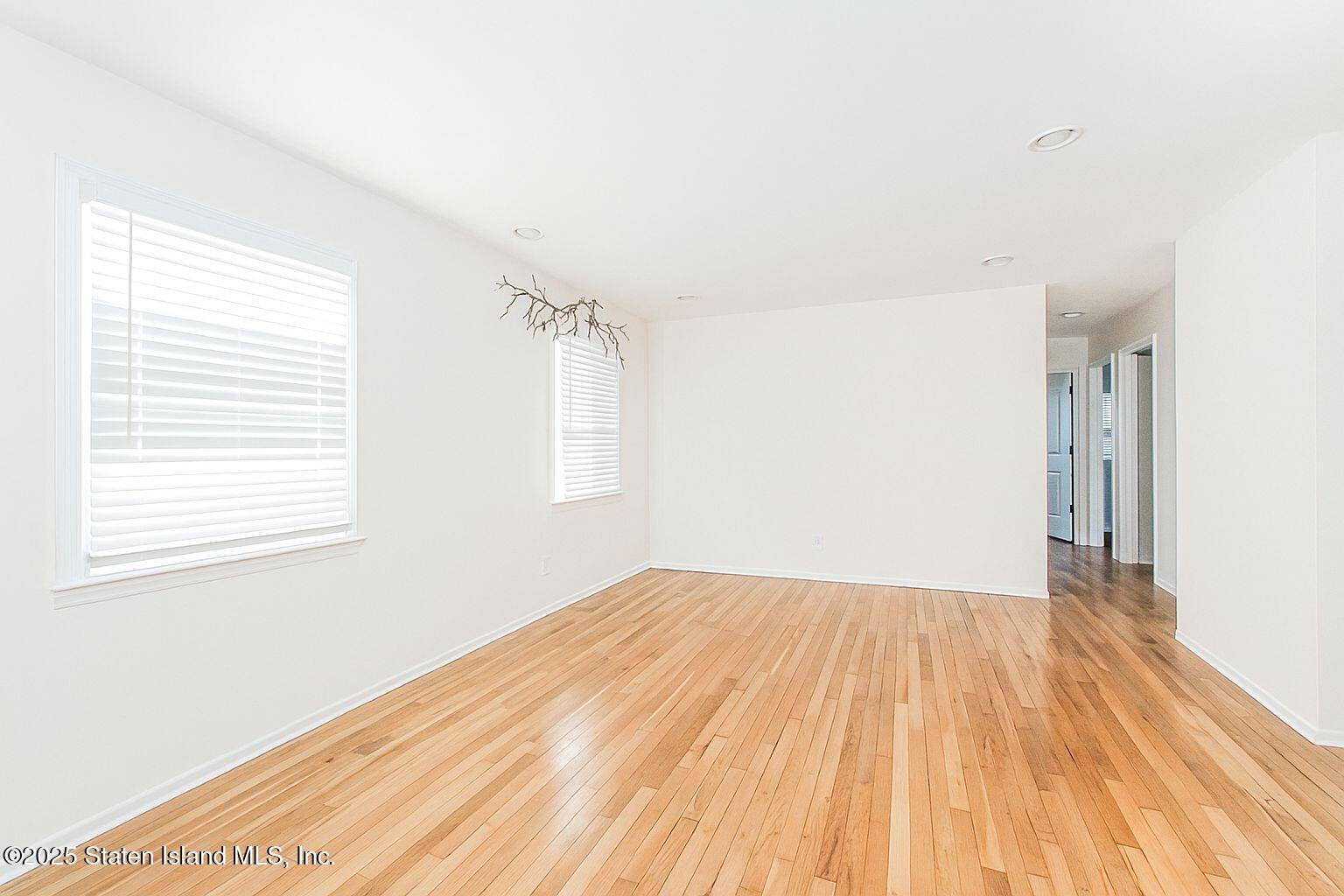 45 Lenevar Avenue Staten Island, NY 10309 - Photo 26 of 35 an empty room with wooden floor and windows