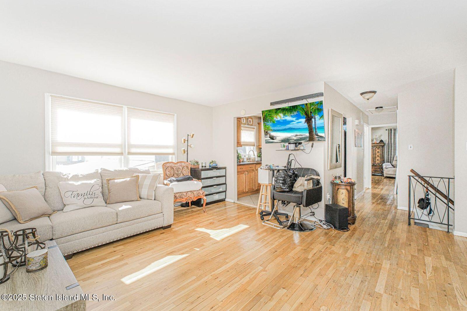 45 Lenevar Avenue Staten Island, NY 10309 - Photo 5 of 35 a living room with furniture and a flat screen tv