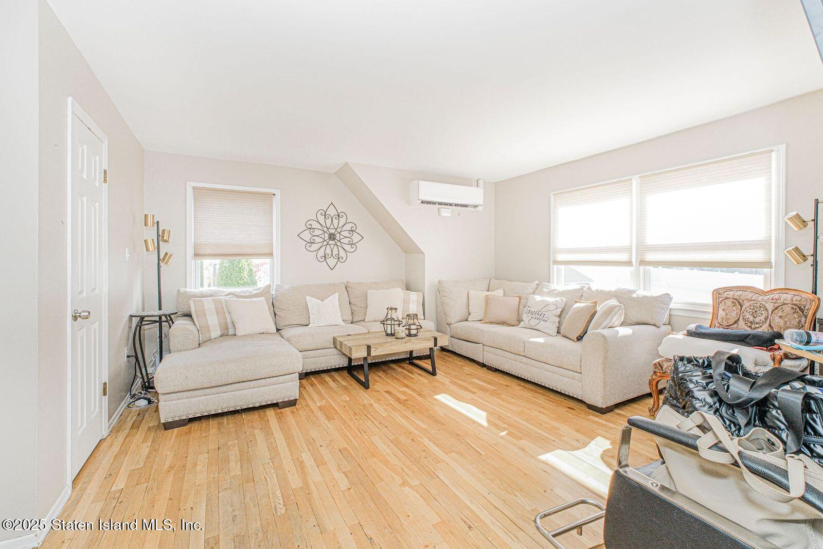 45 Lenevar Avenue Staten Island, NY 10309 - Photo 6 of 35 a living room with furniture and a large window