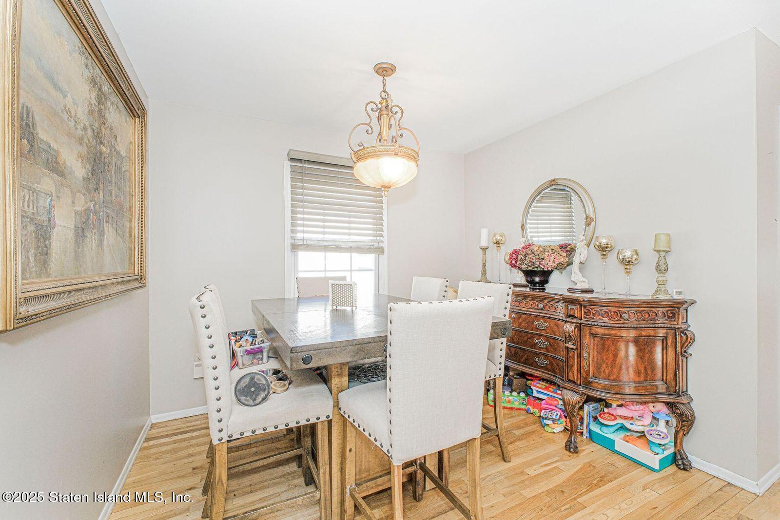 45 Lenevar Avenue Staten Island, NY 10309 - Photo 8 of 35 a view of a dining room with furniture and wooden floor