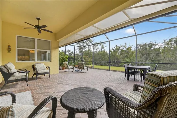 a view of a house with a backyard porch and sitting area