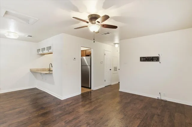 a kitchen with stainless steel appliances granite countertop a sink a stove and a microwave