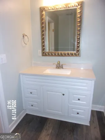 a bathroom with a sink and a mirror