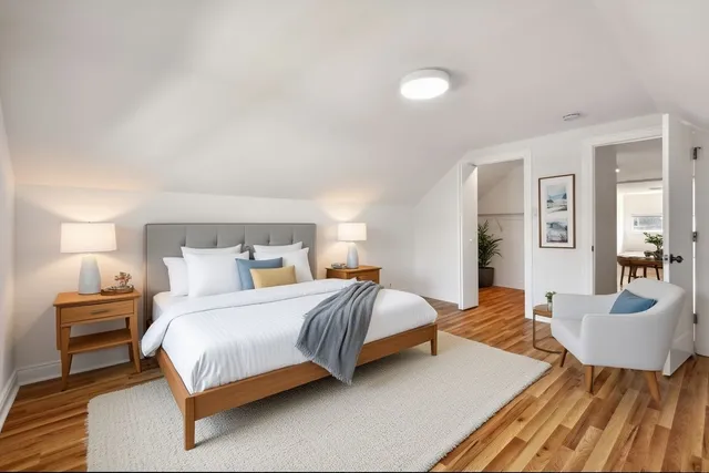 a bedroom with a bed and lamp