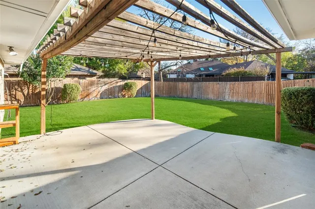a view of a backyard and front of a house