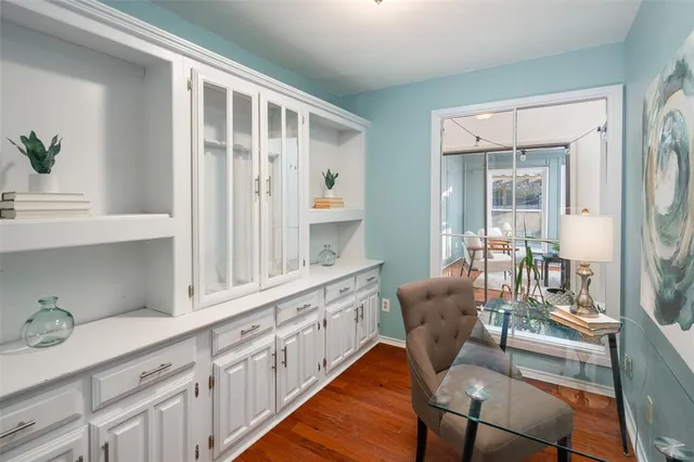 a living room with furniture a fireplace and a potted plant