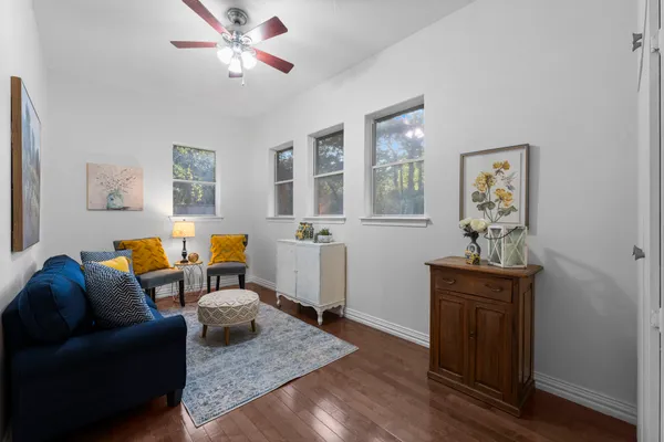 a living room with furniture and white walls