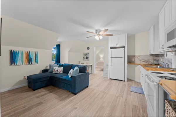 a kitchen with cabinets a sink and appliances