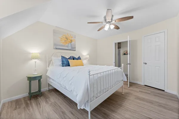 a bathroom with a sink a toilet and a shower curtain