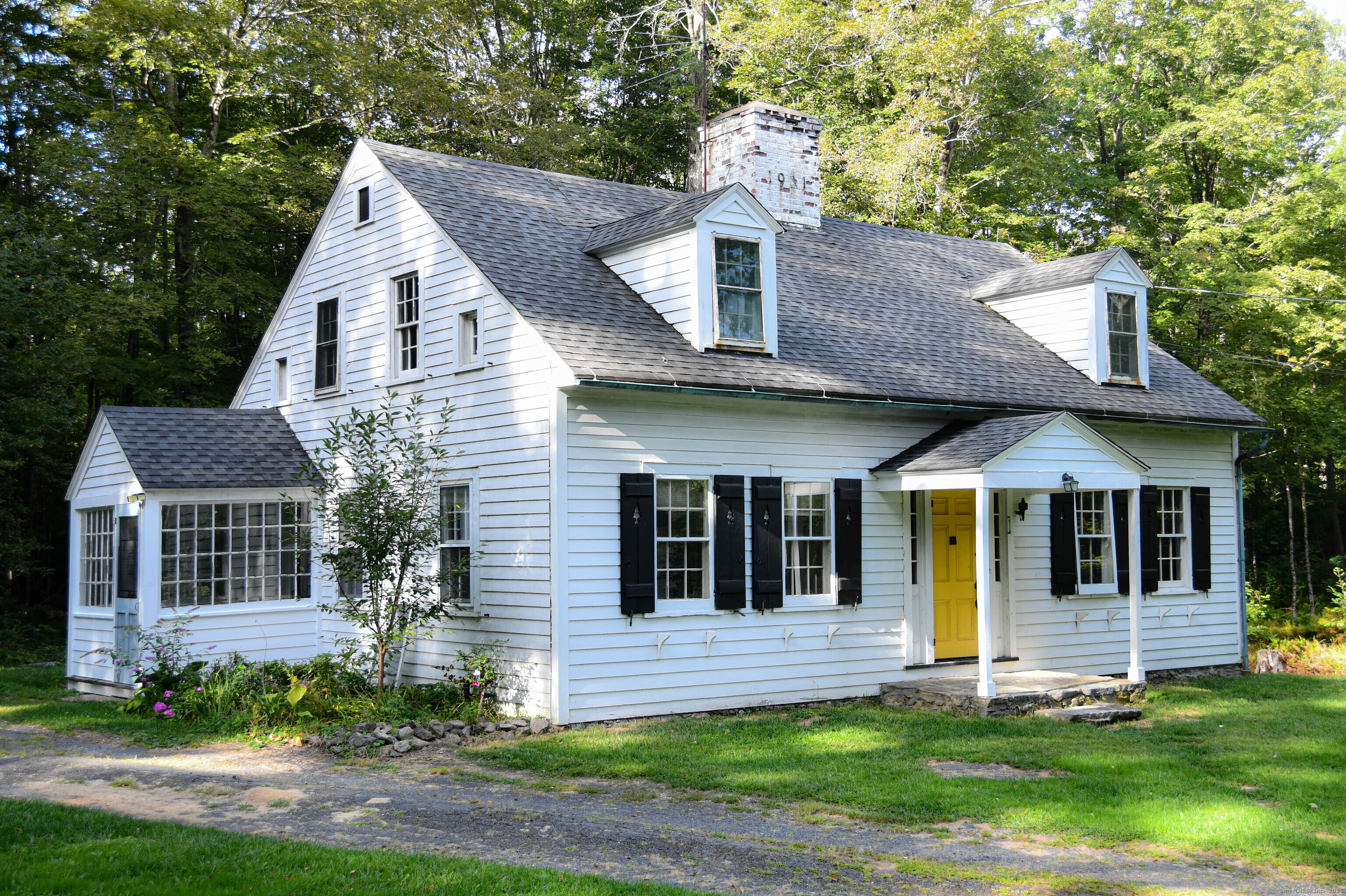 47 Scoville Road Cornwall, CT 06796 - Photo 1 of 1 a view of a white house with a yard plants and large tree