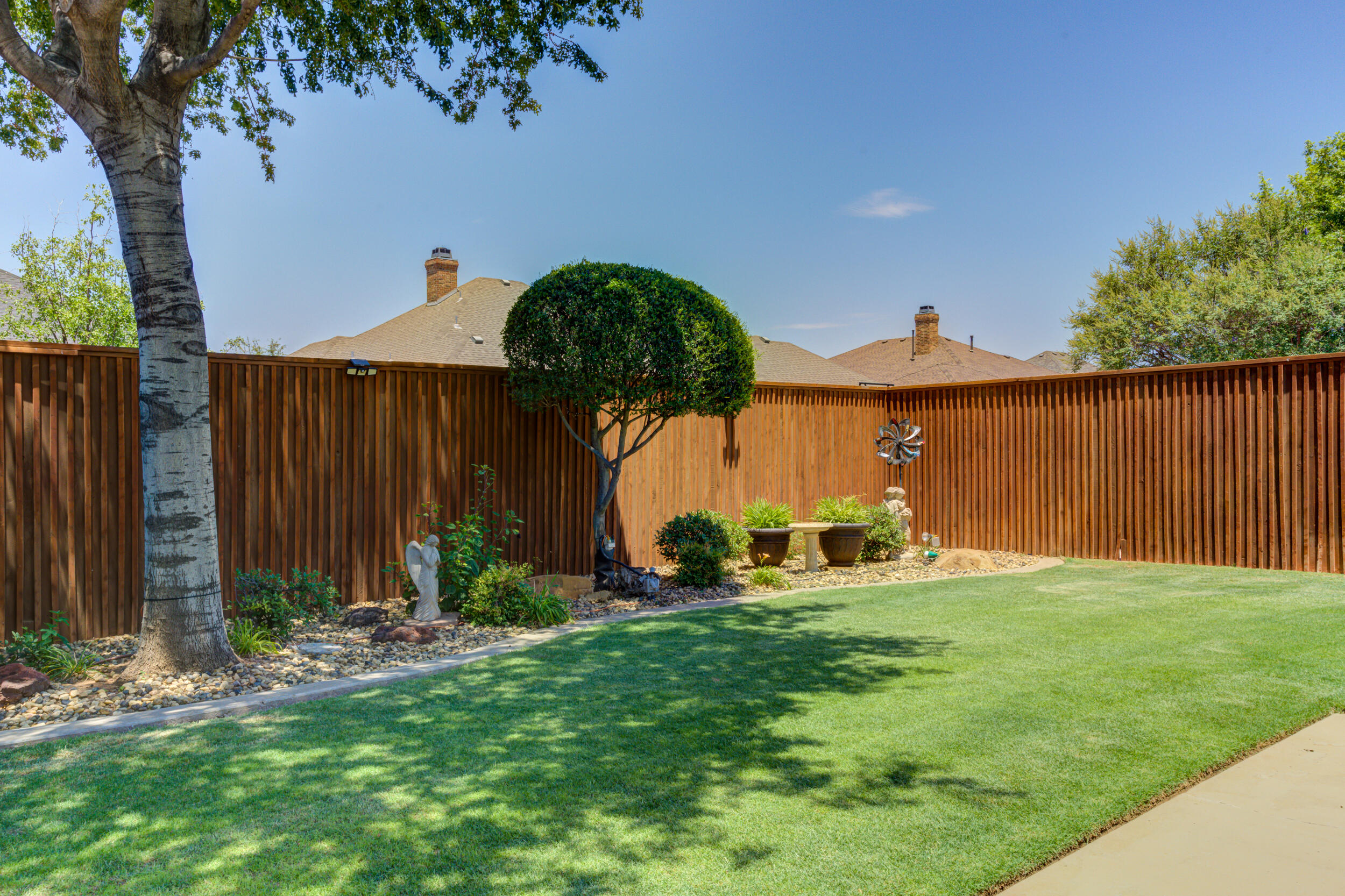 6008 89th Street Lubbock, TX 79424 - Photo 55 of 61 a front view of a house with garden