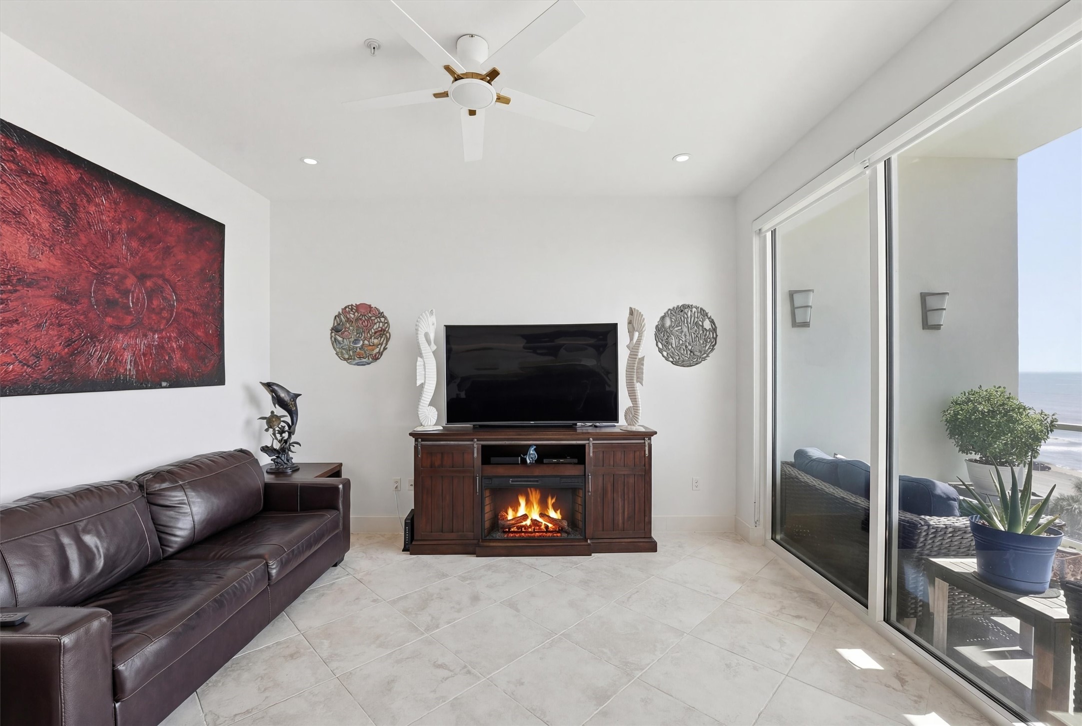 10327 Termini-San Luis Pass Road, Unit 616 Galveston, TX 77554 - Photo 11 of 38 a living room with furniture and a flat screen tv