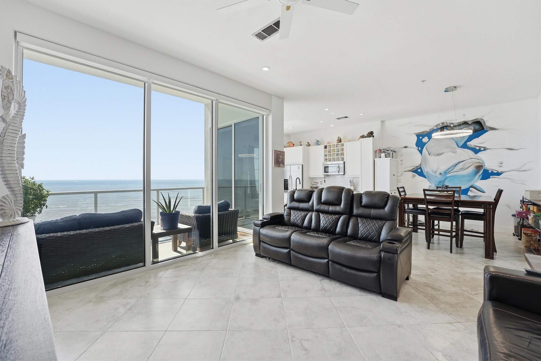 10327 Termini-San Luis Pass Road, Unit 616 Galveston, TX 77554 - Photo 14 of 38 a living room with furniture and a large window