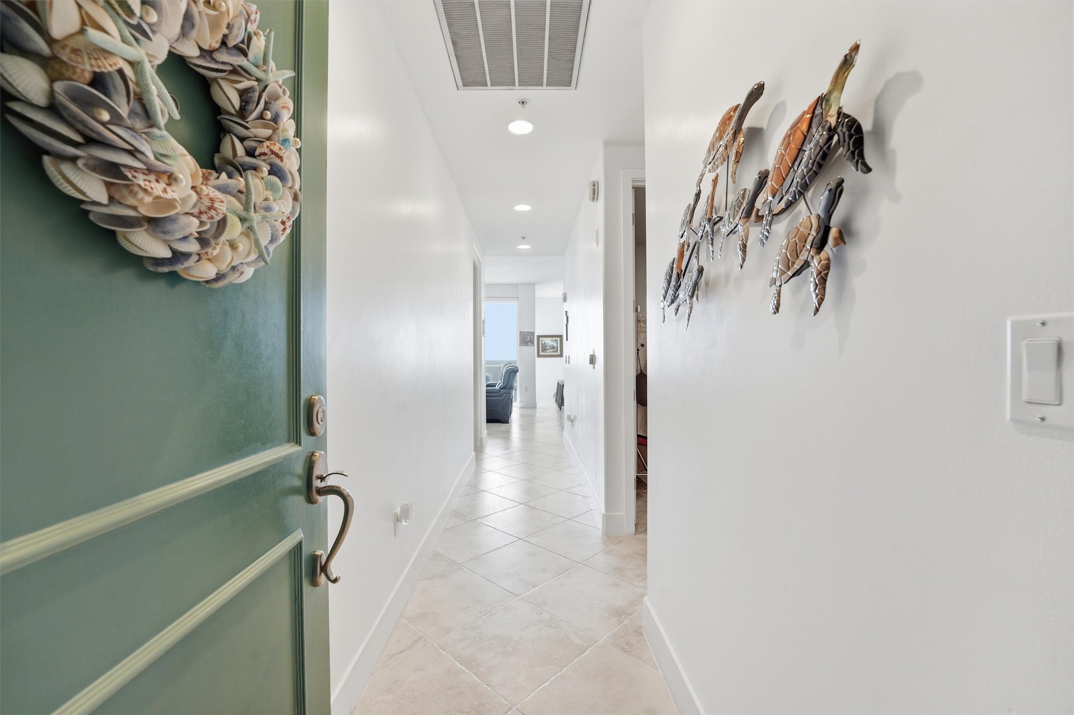 10327 Termini-San Luis Pass Road, Unit 616 Galveston, TX 77554 - Photo 2 of 38 a view of a hallway with white walls