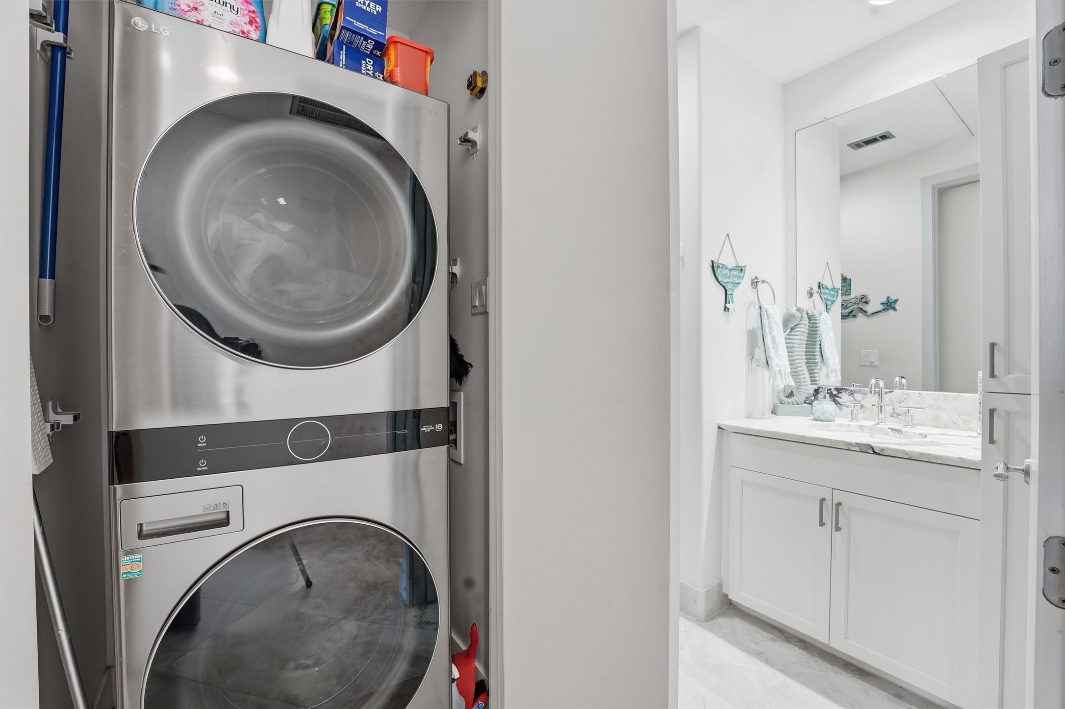 10327 Termini-San Luis Pass Road, Unit 616 Galveston, TX 77554 - Photo 21 of 38 a bathroom with a washer and dryer