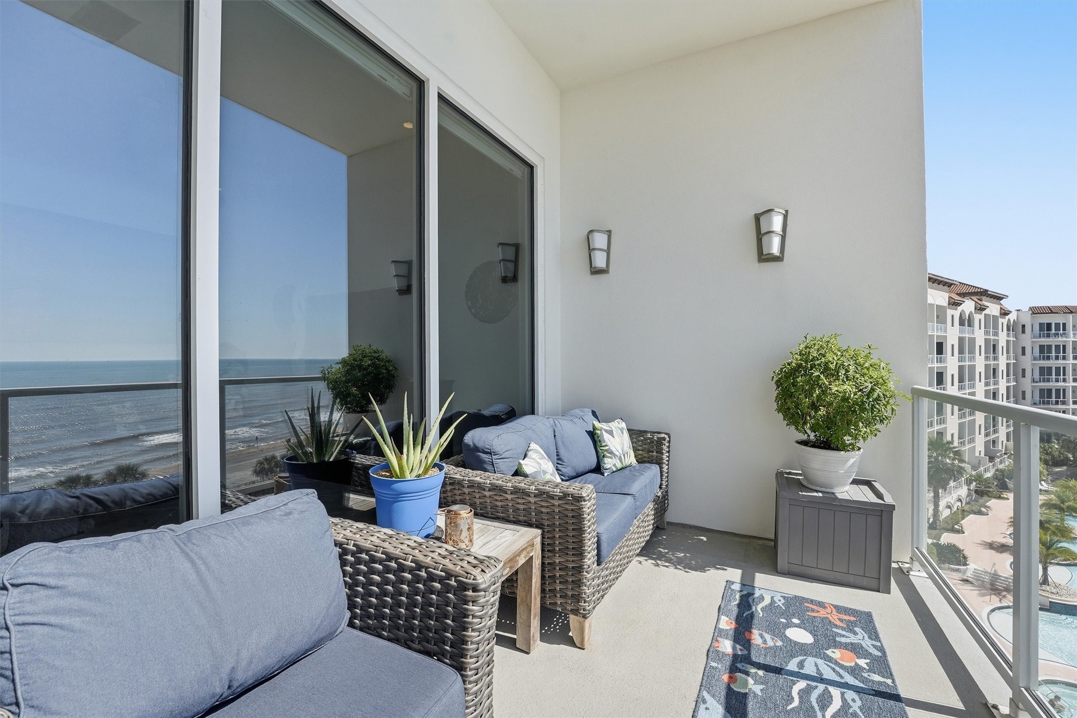 10327 Termini-San Luis Pass Road, Unit 616 Galveston, TX 77554 - Photo 22 of 38 a living room with furniture potted plant and a window