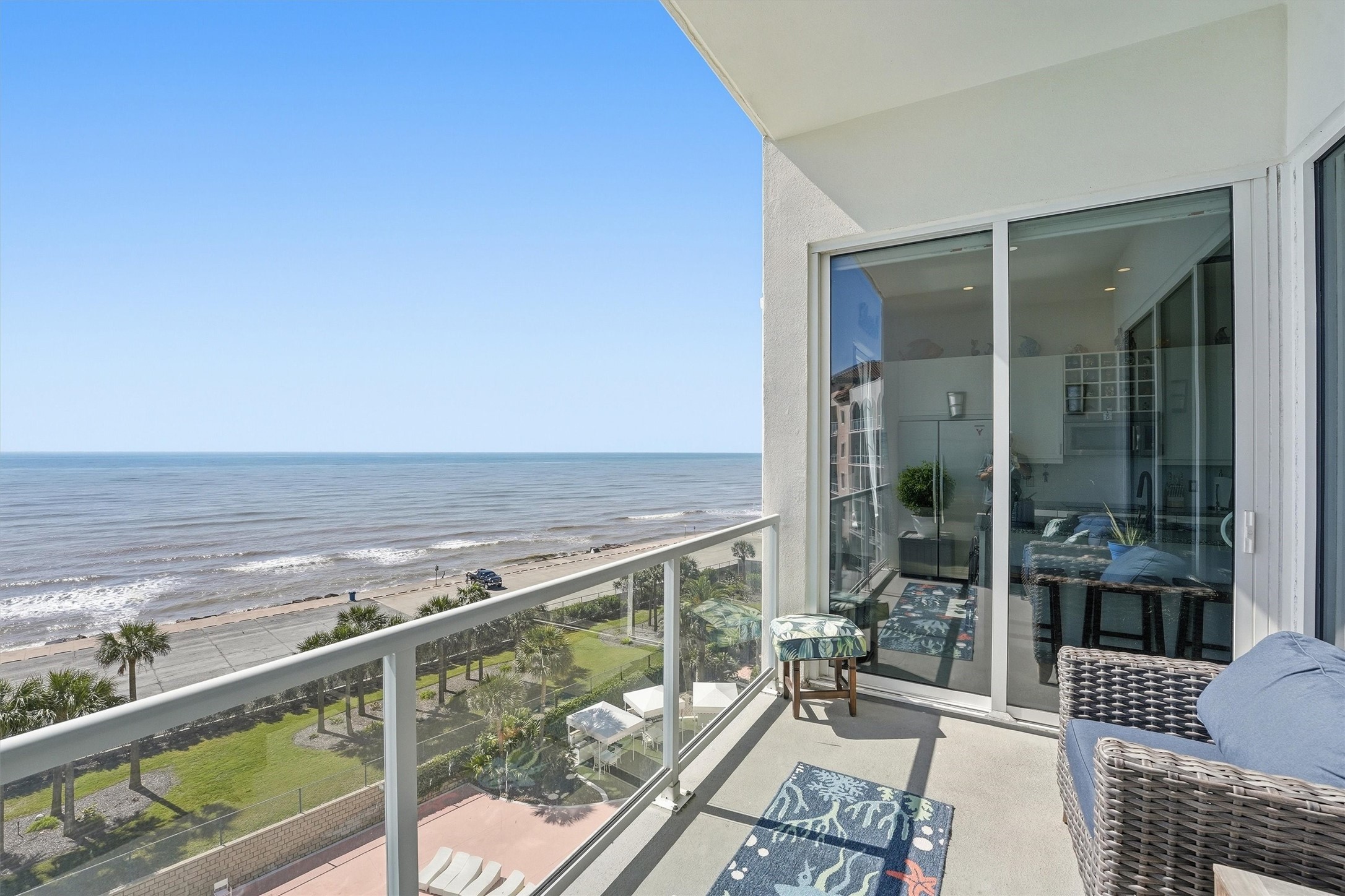 10327 Termini-San Luis Pass Road, Unit 616 Galveston, TX 77554 - Photo 25 of 38 a view of a balcony with wooden floor