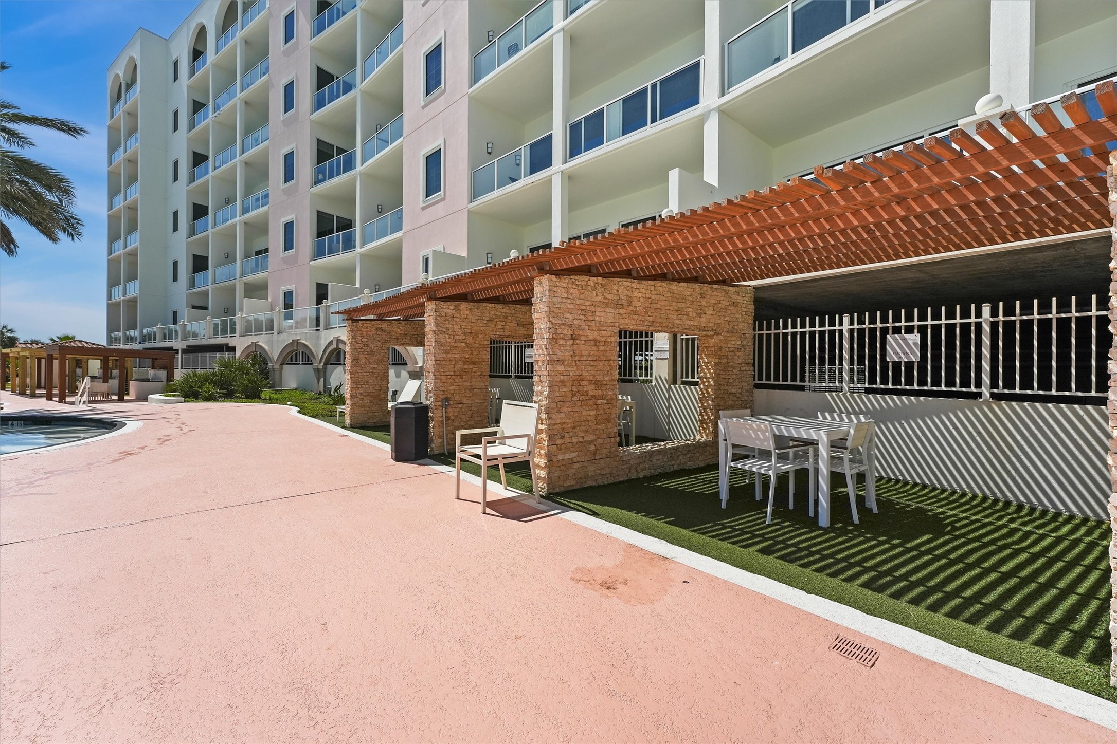 10327 Termini-San Luis Pass Road, Unit 616 Galveston, TX 77554 - Photo 34 of 38 a patio with a table and chairs