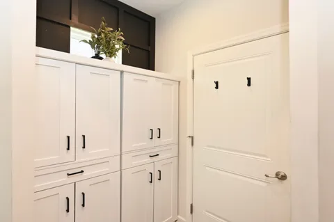 a bathroom with a shower and a mirror
