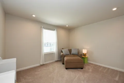 a living room with furniture and window