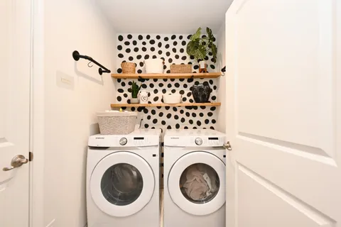 a utility room with dryer and washer