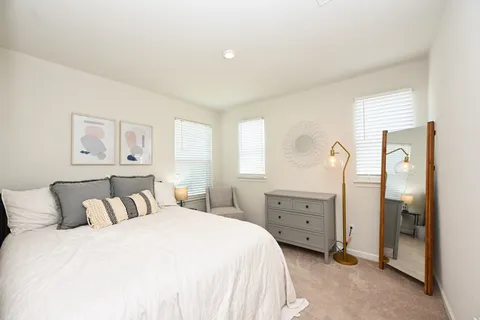 a bedroom with a bed and a cabinets