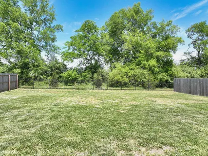 a view of a field with an outdoor space