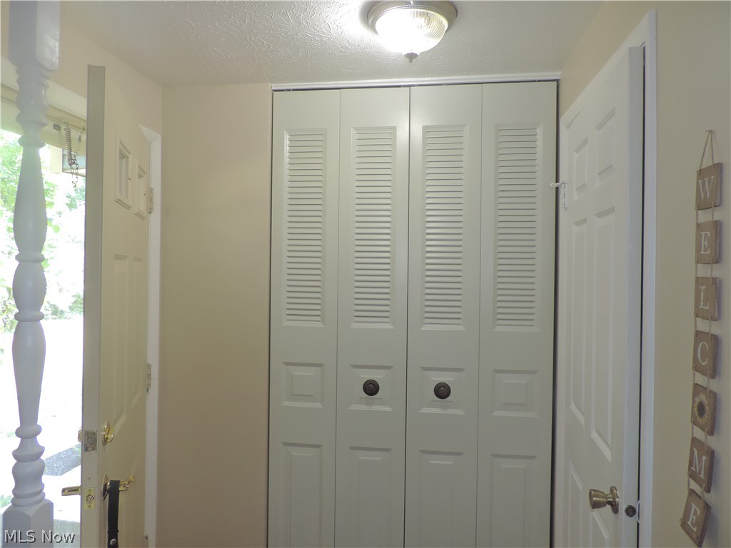 139 Quaker Ridge Drive Akron, OH 44313 - Photo 12 of 16 Entry way with new vinyl flooring Half bath just off this space