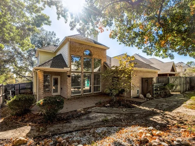 a view of a house with a tree