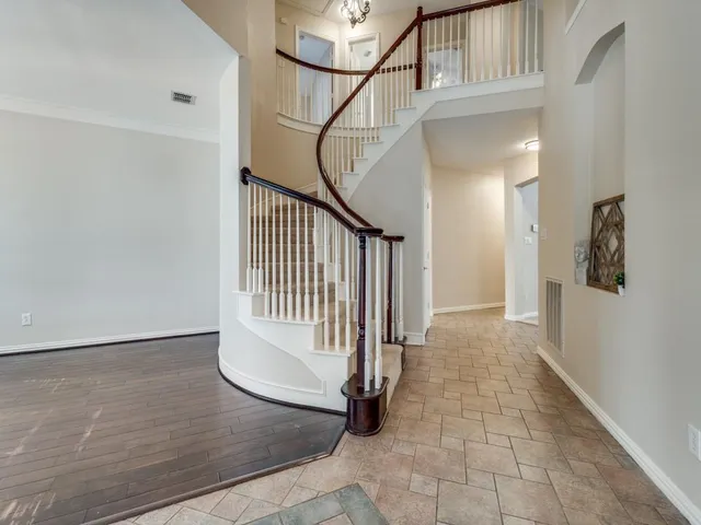 a view of a hallway with staircase