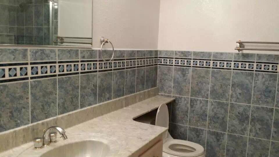 930 Mission Road, Unit 38 South San Francisco, CA 94080 - Photo 2 of 5 a bathroom with a sink a toilet and a mirror
