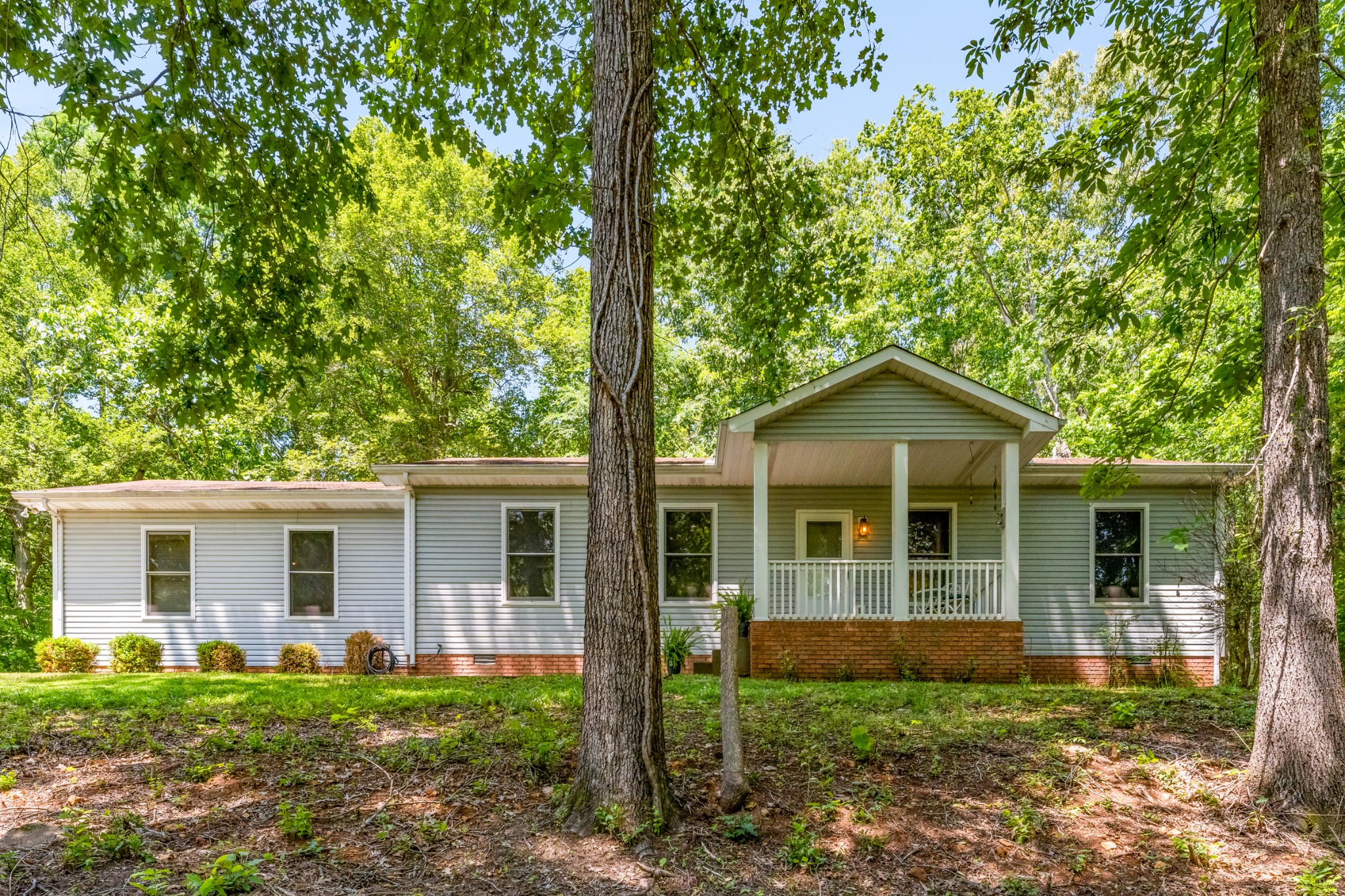 front view of a house with a yard