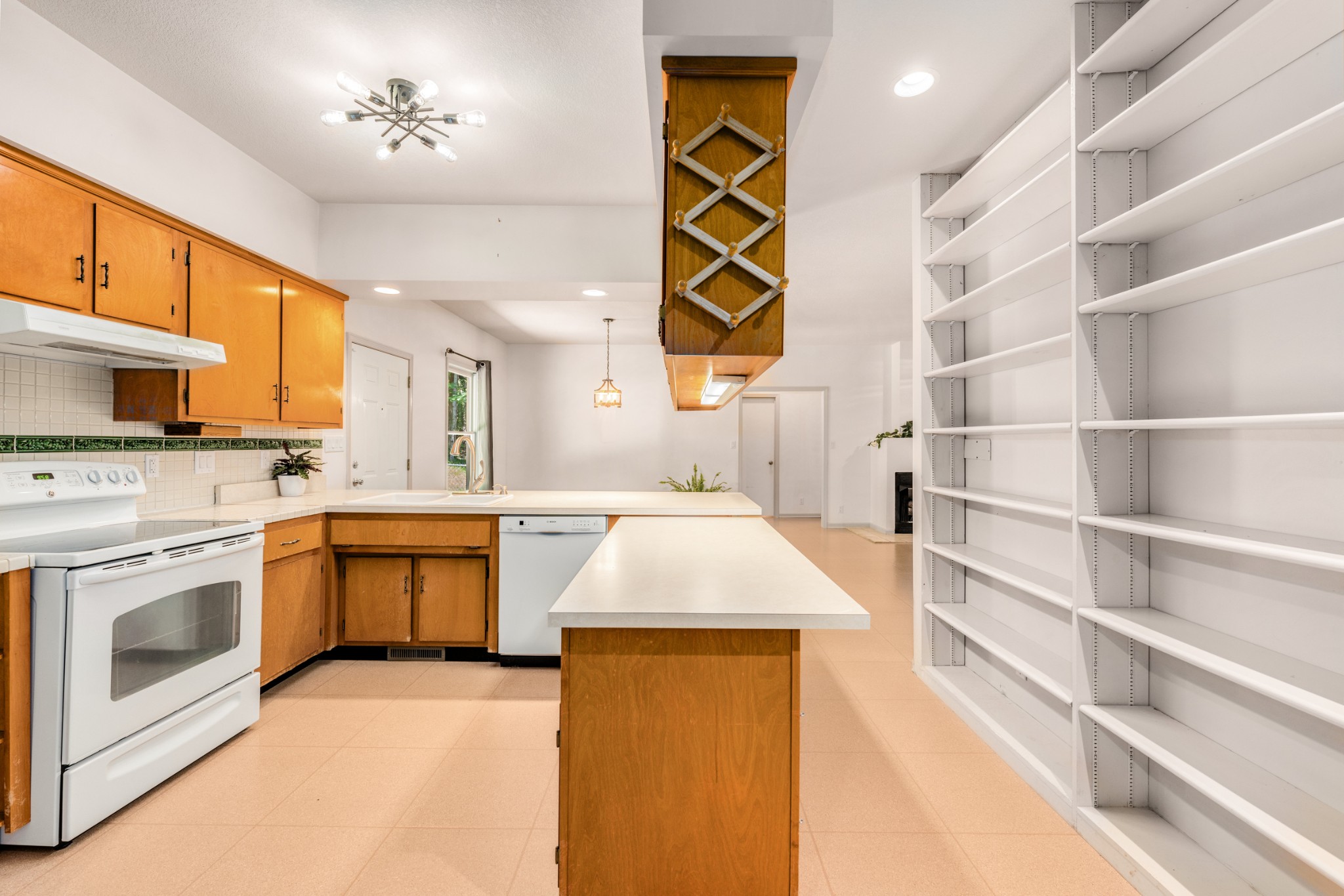 358 Harper Road Clarksville, TN 37043 - Photo 20 of 34 a kitchen with stainless steel appliances granite countertop a stove and a sink