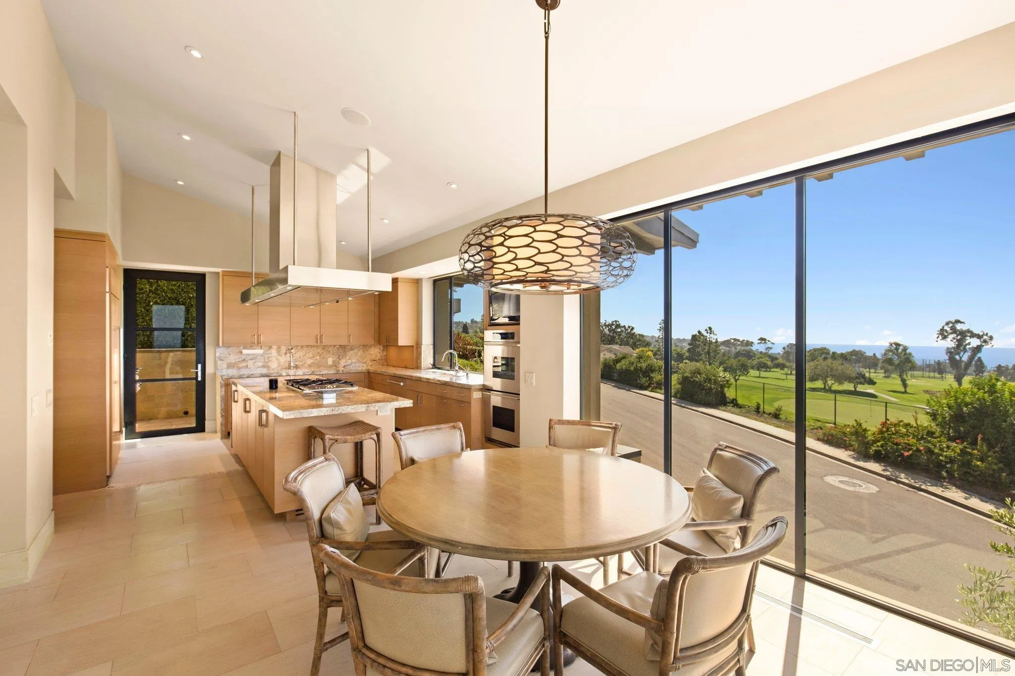 7413 Fairway Road La Jolla, CA 92037 - Photo 19 of 40 a very nice looking dining room with a table and chairs