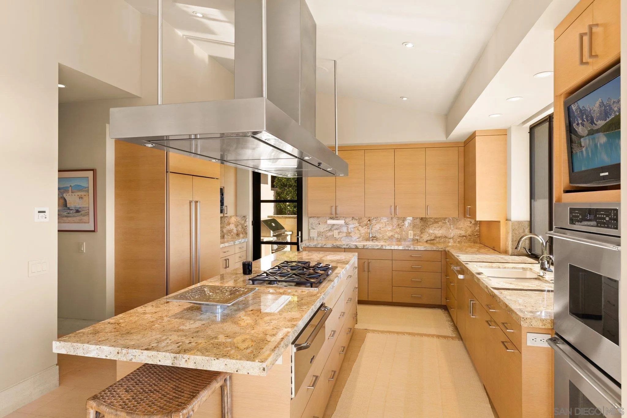 7413 Fairway Road La Jolla, CA 92037 - Photo 20 of 40 a kitchen with a stove a sink and a refrigerator