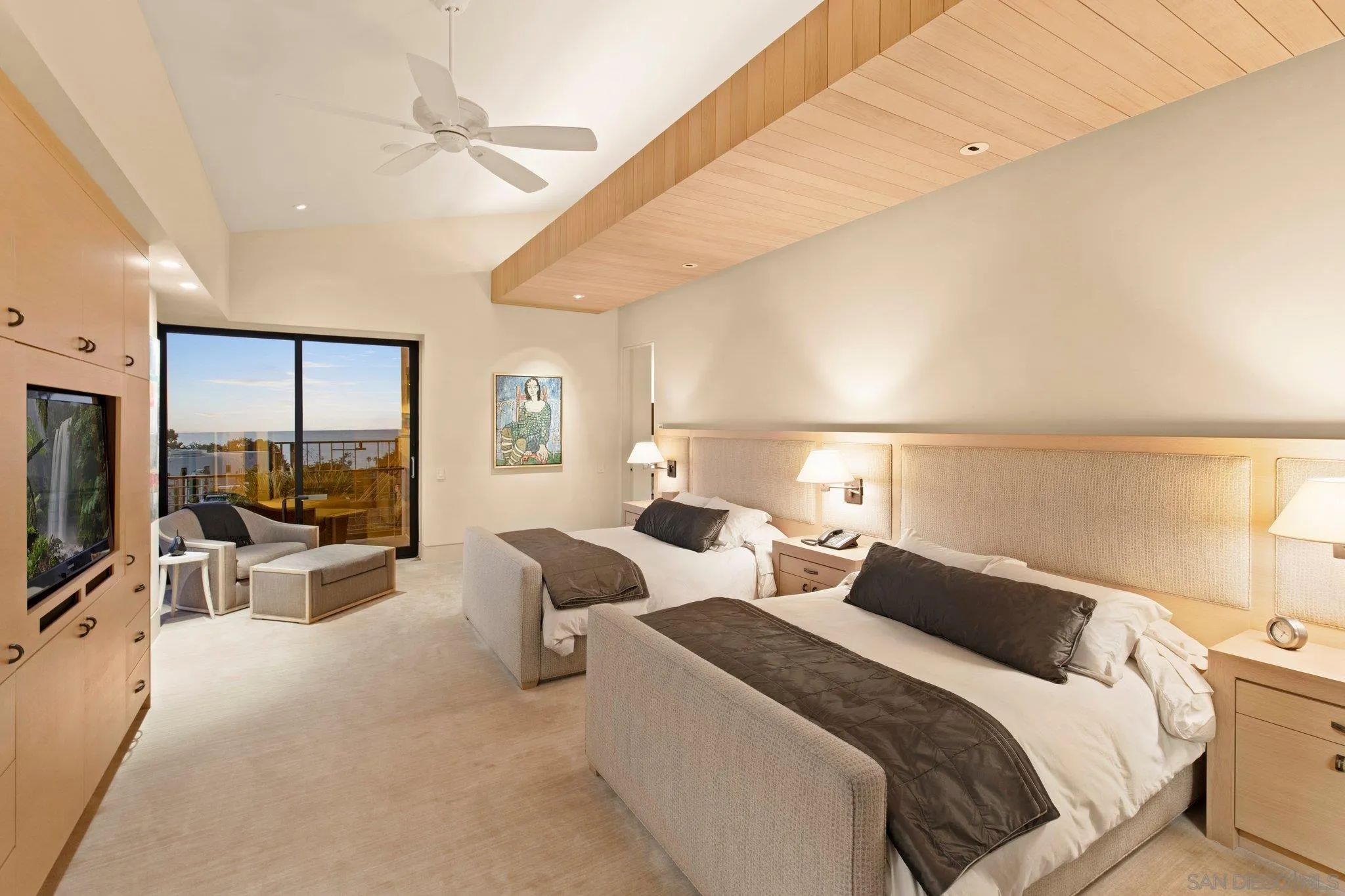 7413 Fairway Road La Jolla, CA 92037 - Photo 22 of 40 a bedroom with two beds and large windows