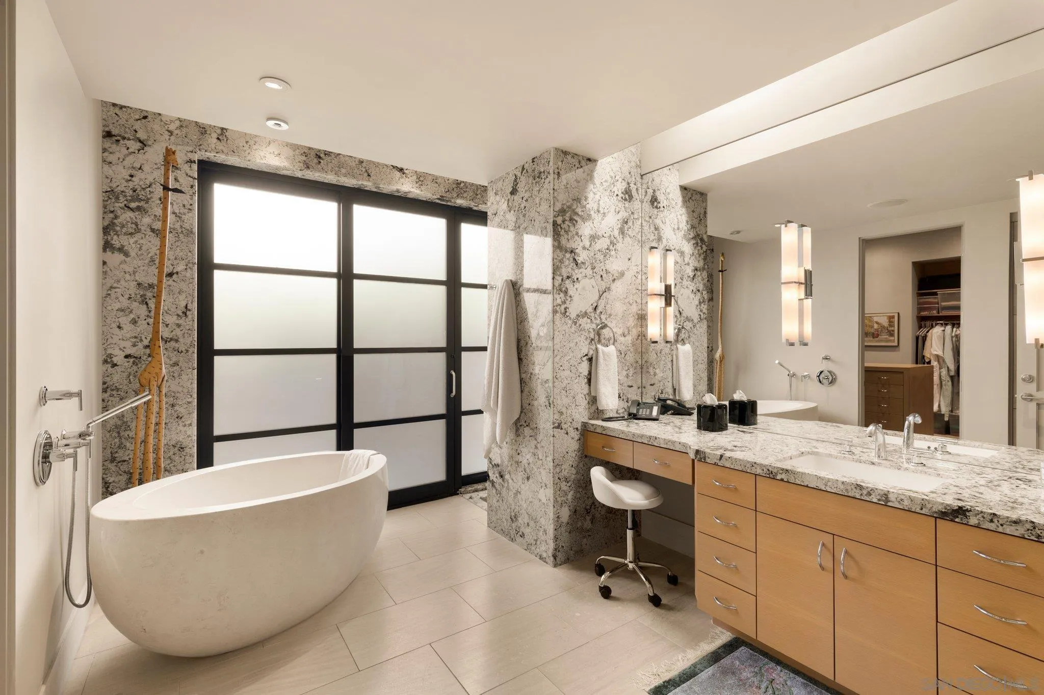 7413 Fairway Road La Jolla, CA 92037 - Photo 23 of 40 a bathroom with a granite countertop tub sink and mirror