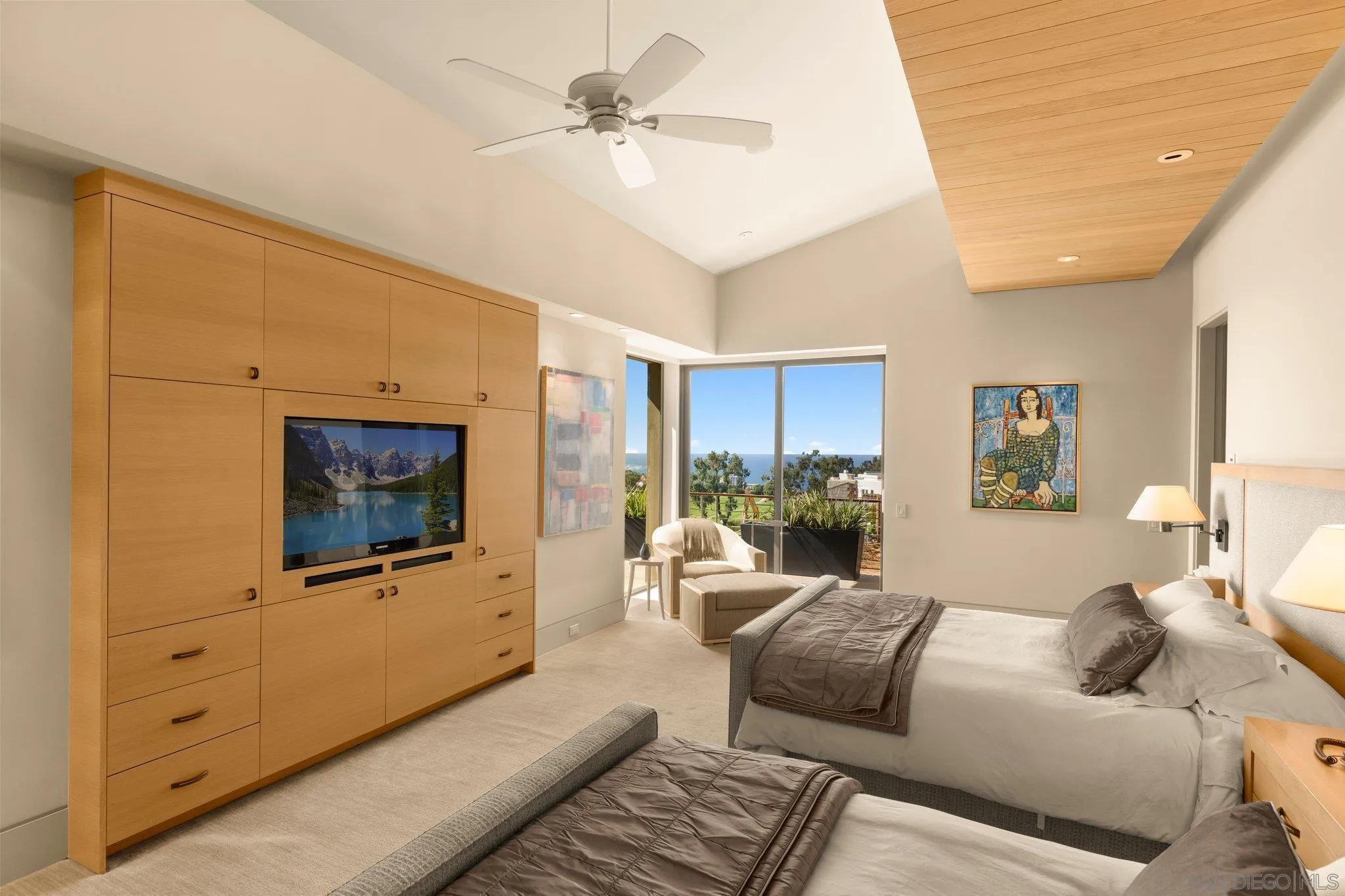 7413 Fairway Road La Jolla, CA 92037 - Photo 24 of 40 a living room with furniture a flat screen tv and a window