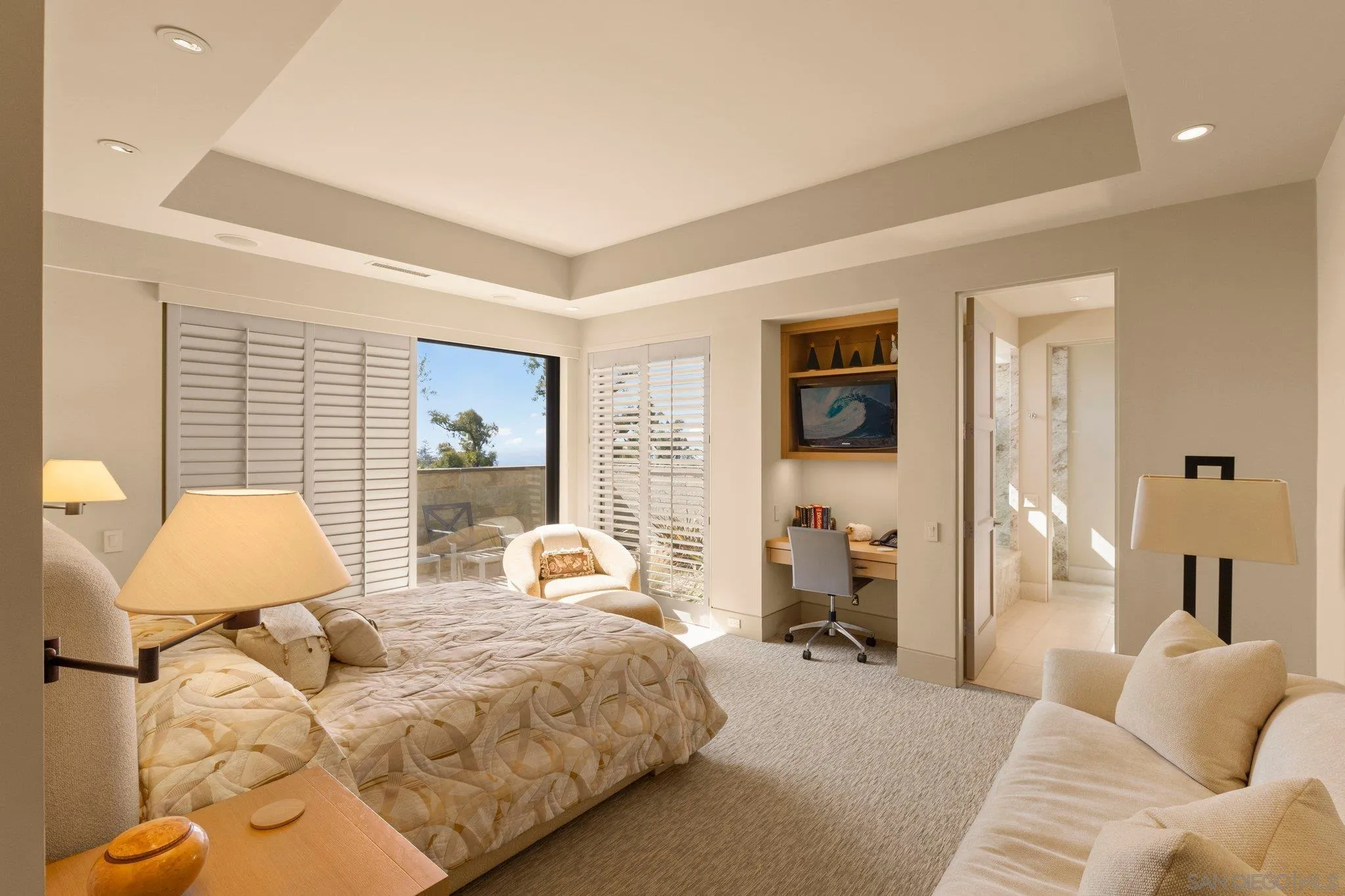 7413 Fairway Road La Jolla, CA 92037 - Photo 25 of 40 a bedroom with a bed and wooden floor