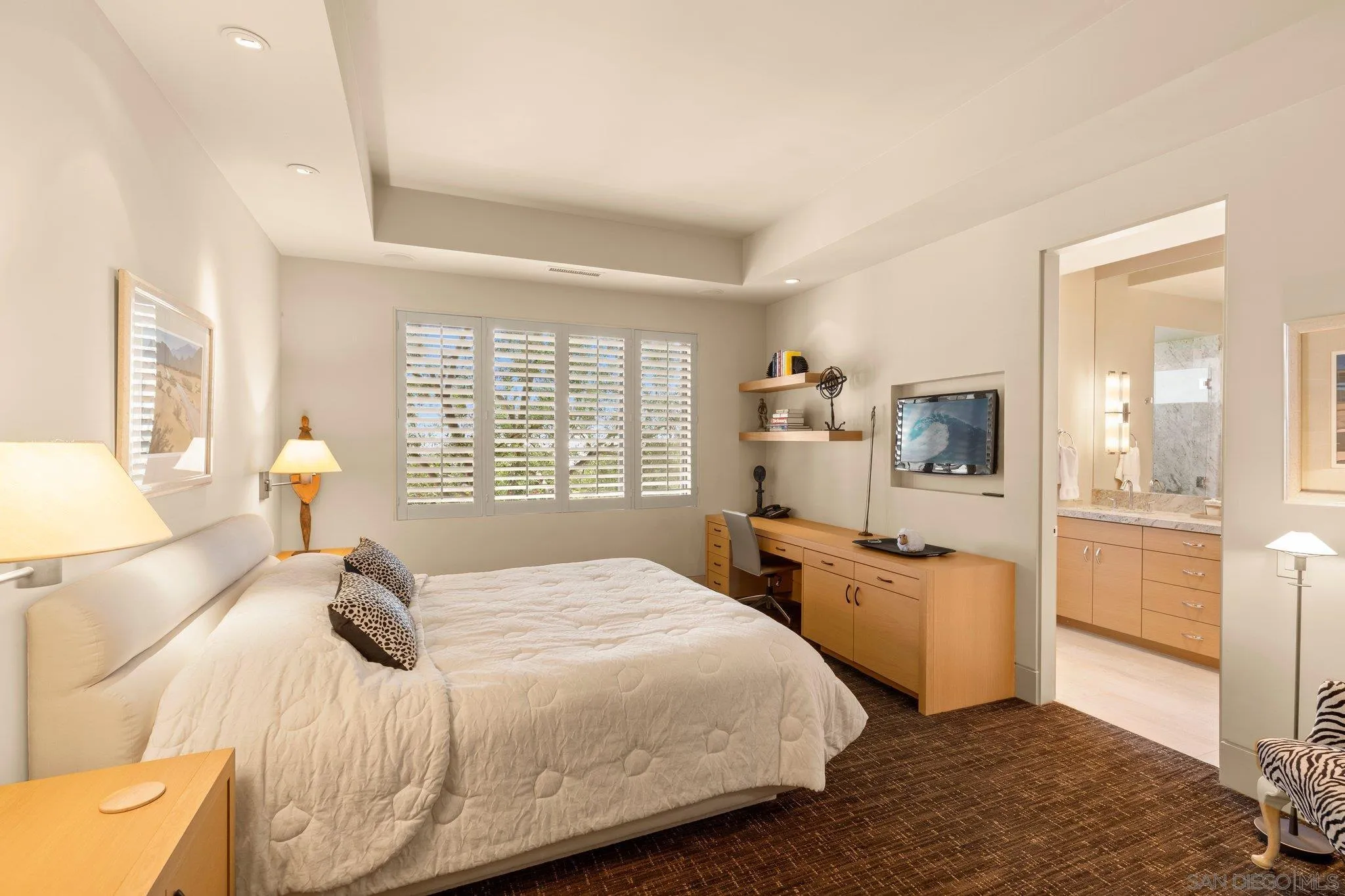 7413 Fairway Road La Jolla, CA 92037 - Photo 27 of 40 a bedroom with a bed and wooden floor