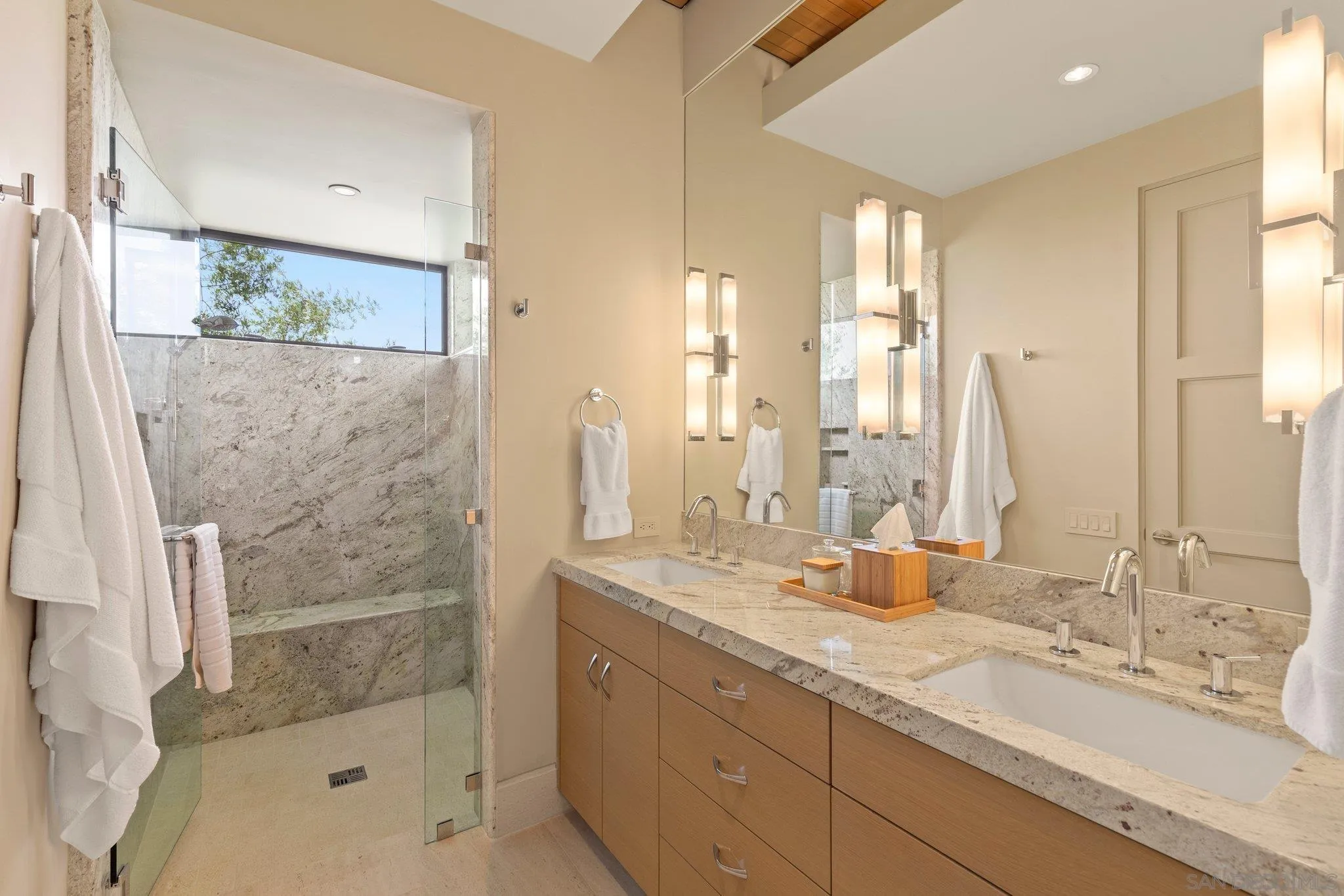 7413 Fairway Road La Jolla, CA 92037 - Photo 28 of 40 a bathroom with a double vanity sink mirror and shower