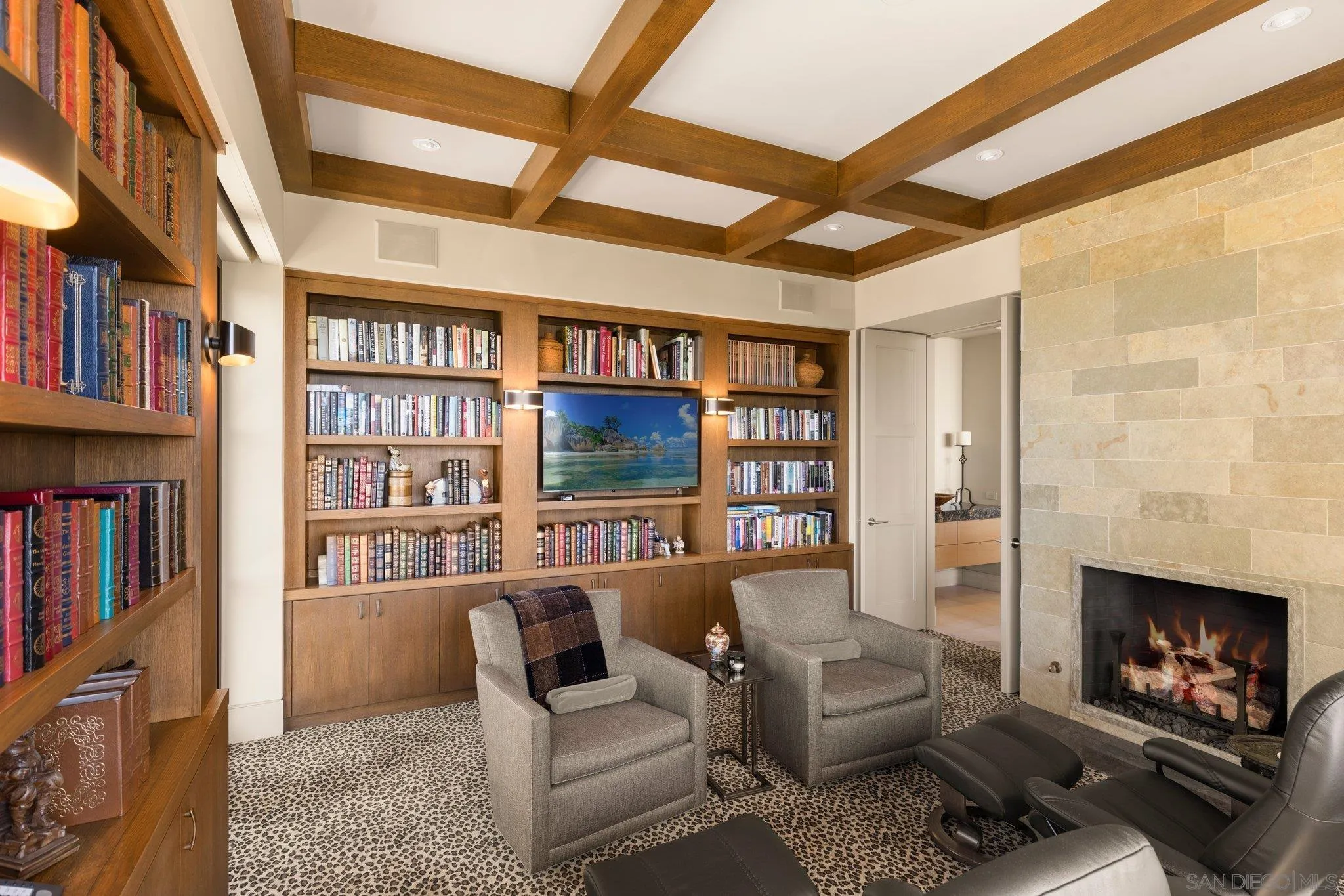 7413 Fairway Road La Jolla, CA 92037 - Photo 32 of 40 a living room with furniture and a book shelf