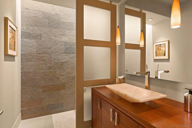 a living room with furniture a dining table and wooden floor