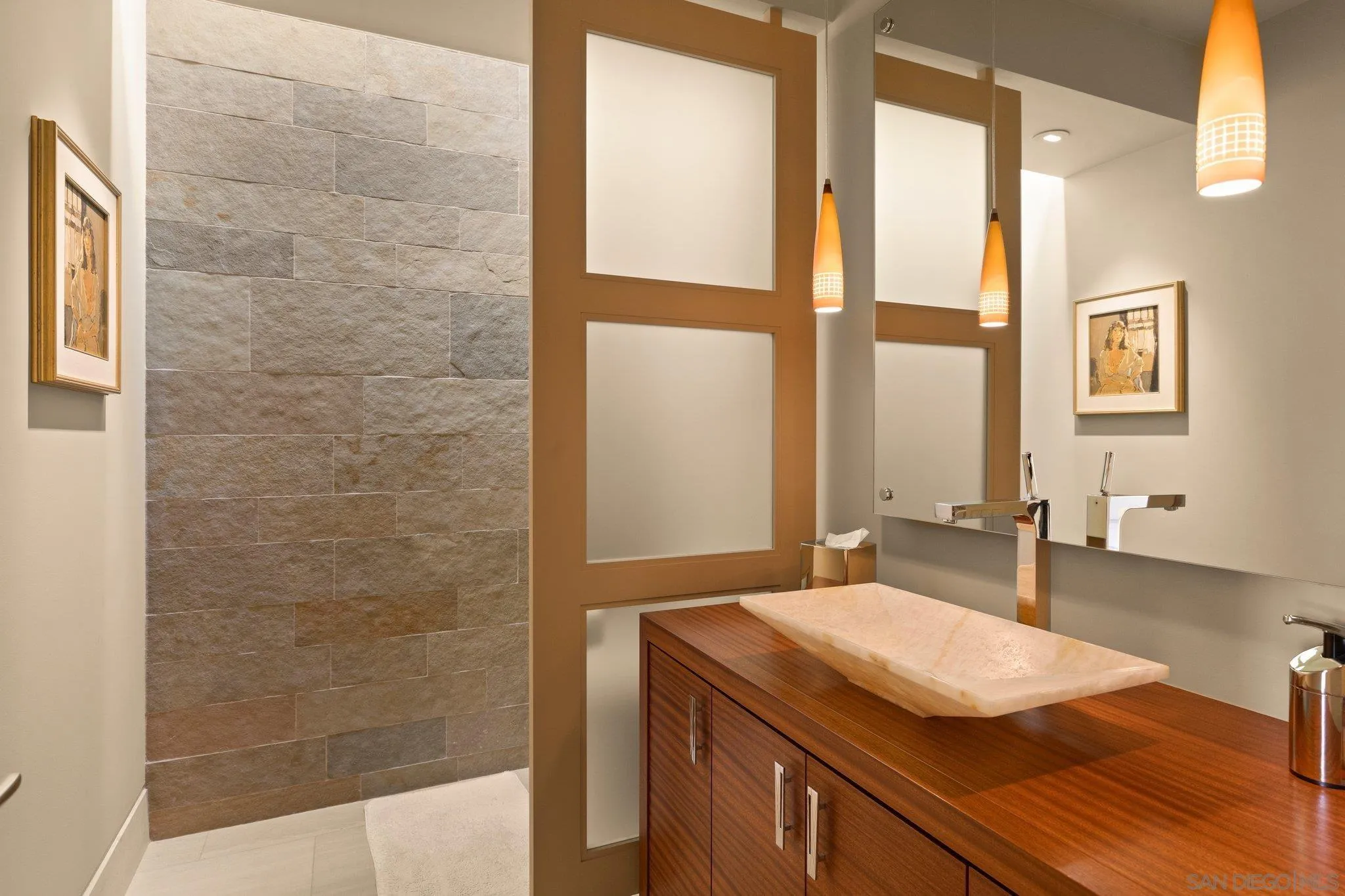 7413 Fairway Road La Jolla, CA 92037 - Photo 33 of 40 a bathroom with a granite countertop sink and a mirror