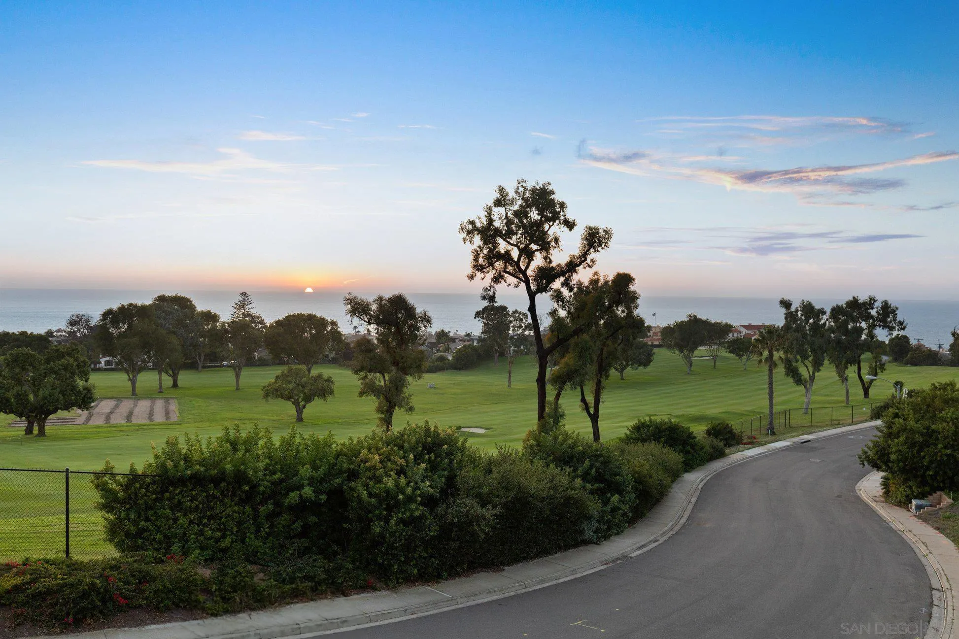 7413 Fairway Road La Jolla, CA 92037 - Photo 7 of 40 a view of a grassy field with trees