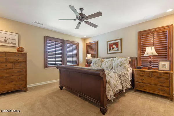 a view of walk in closet with clothes