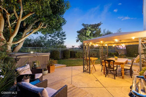 a view of swimming pool with a patio and a yard