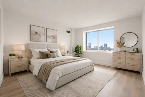 a bedroom with a bed and a dresser