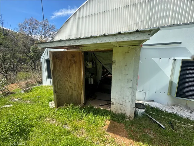 an aerial view of a house with yard swimming pool and outdoor seating